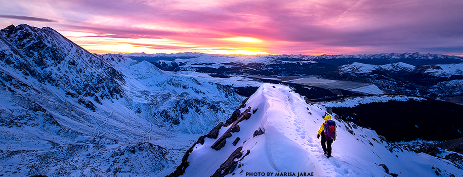 Strategic Plan 2025 - sunrise photo of snow mountains with hiker
